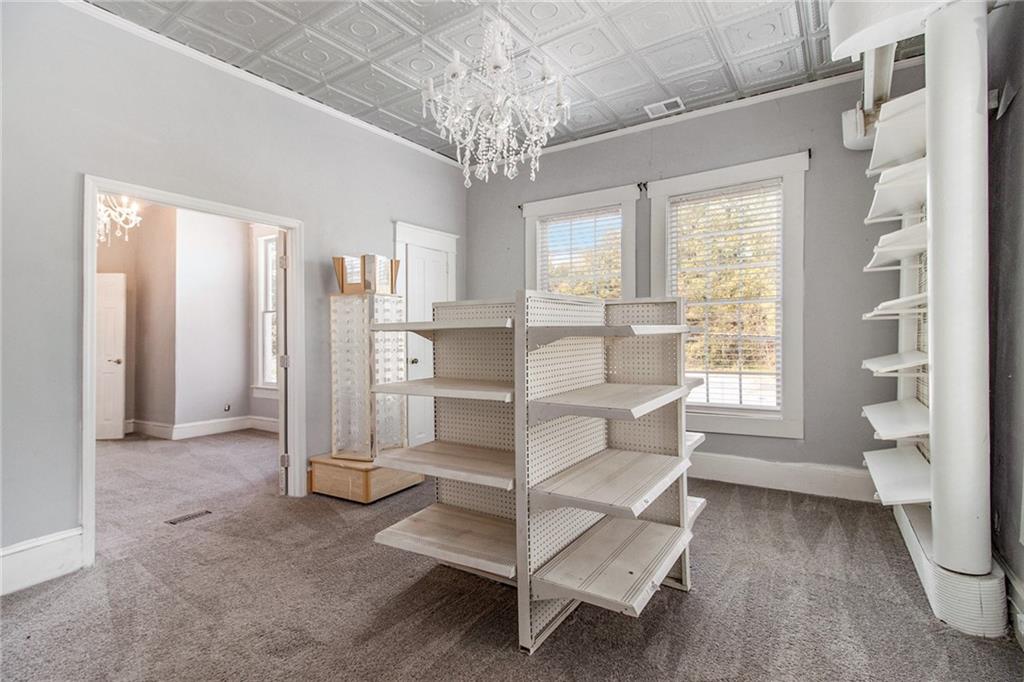 1208 North Broad Street Rome, GA 30161 - Photo 28 of 63 a view of a livingroom with wooden floor and a large window