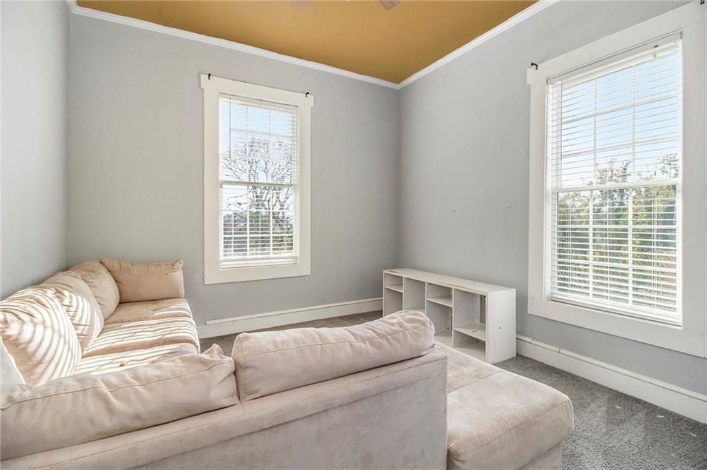 1208 North Broad Street Rome, GA 30161 - Photo 32 of 63 a living room with furniture and a window