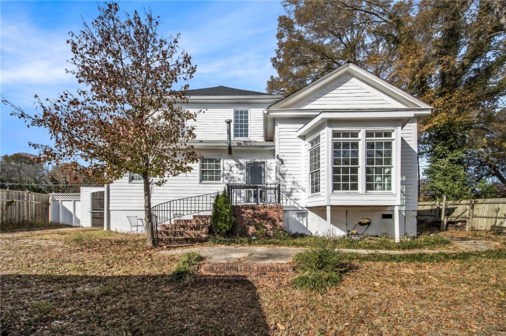 1208 North Broad Street Rome, GA 30161 - Photo 35 of 63 a front view of a house with a yard