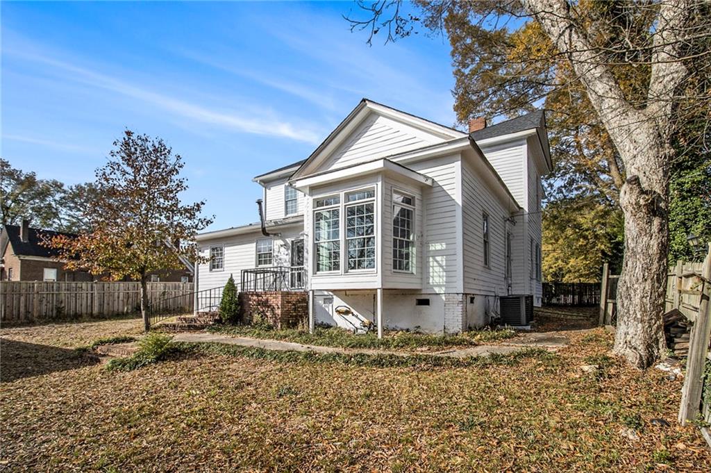 1208 North Broad Street Rome, GA 30161 - Photo 38 of 63 a view of a house with a yard covered in snow