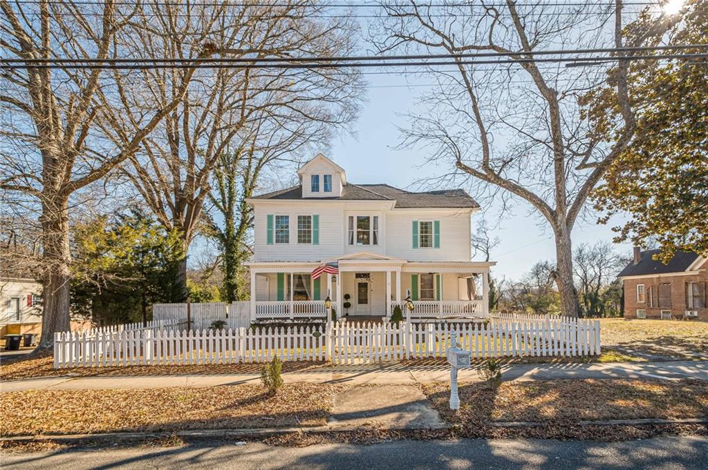 1208 North Broad Street Rome, GA 30161 - Photo 49 of 63 a front view of a house with a garden