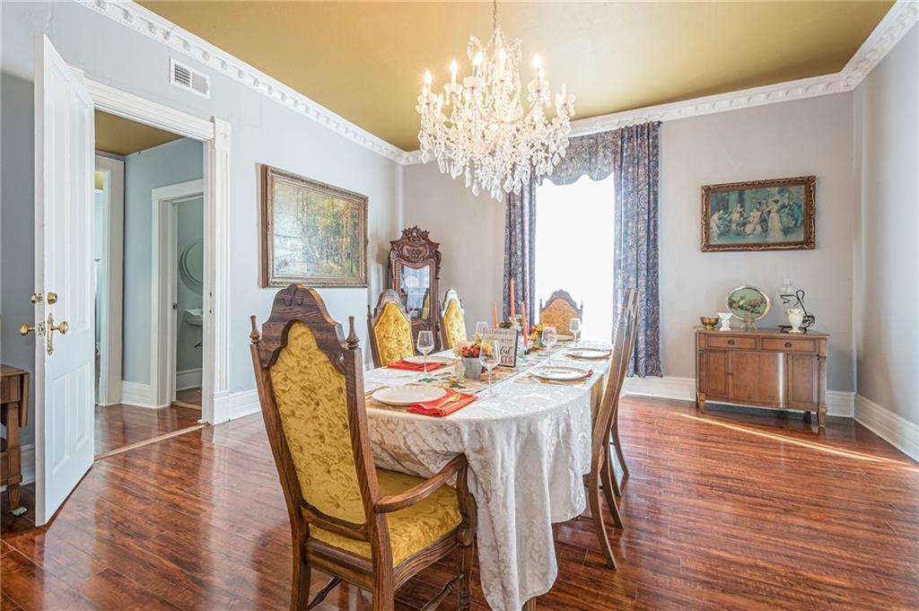 1208 North Broad Street Rome, GA 30161 - Photo 52 of 63 a view of a dining room with furniture a chandelier and wooden floor