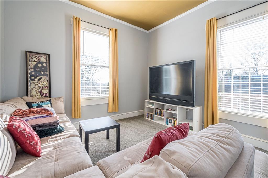1208 North Broad Street Rome, GA 30161 - Photo 58 of 63 a living room with furniture and a flat screen tv