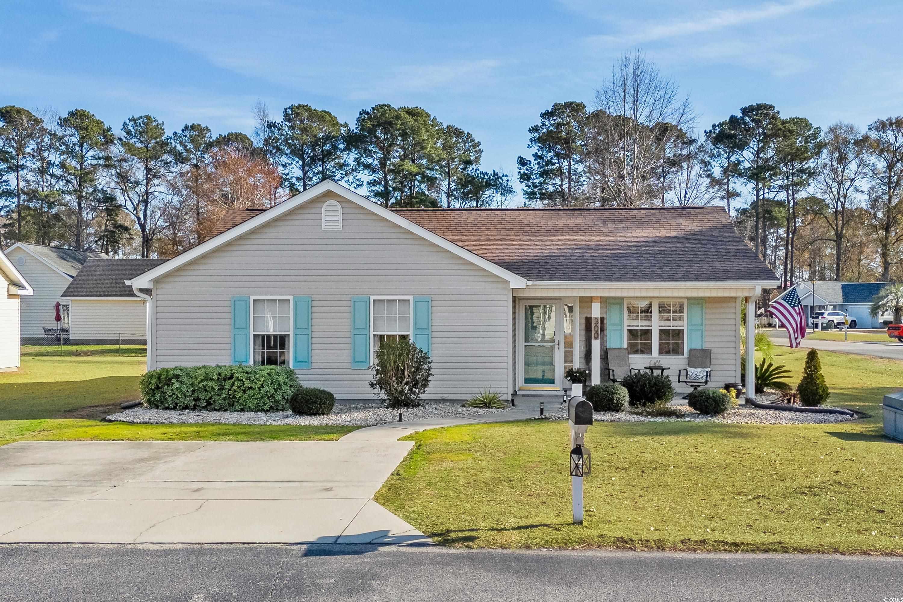 Ranch-style house featuring a front yard