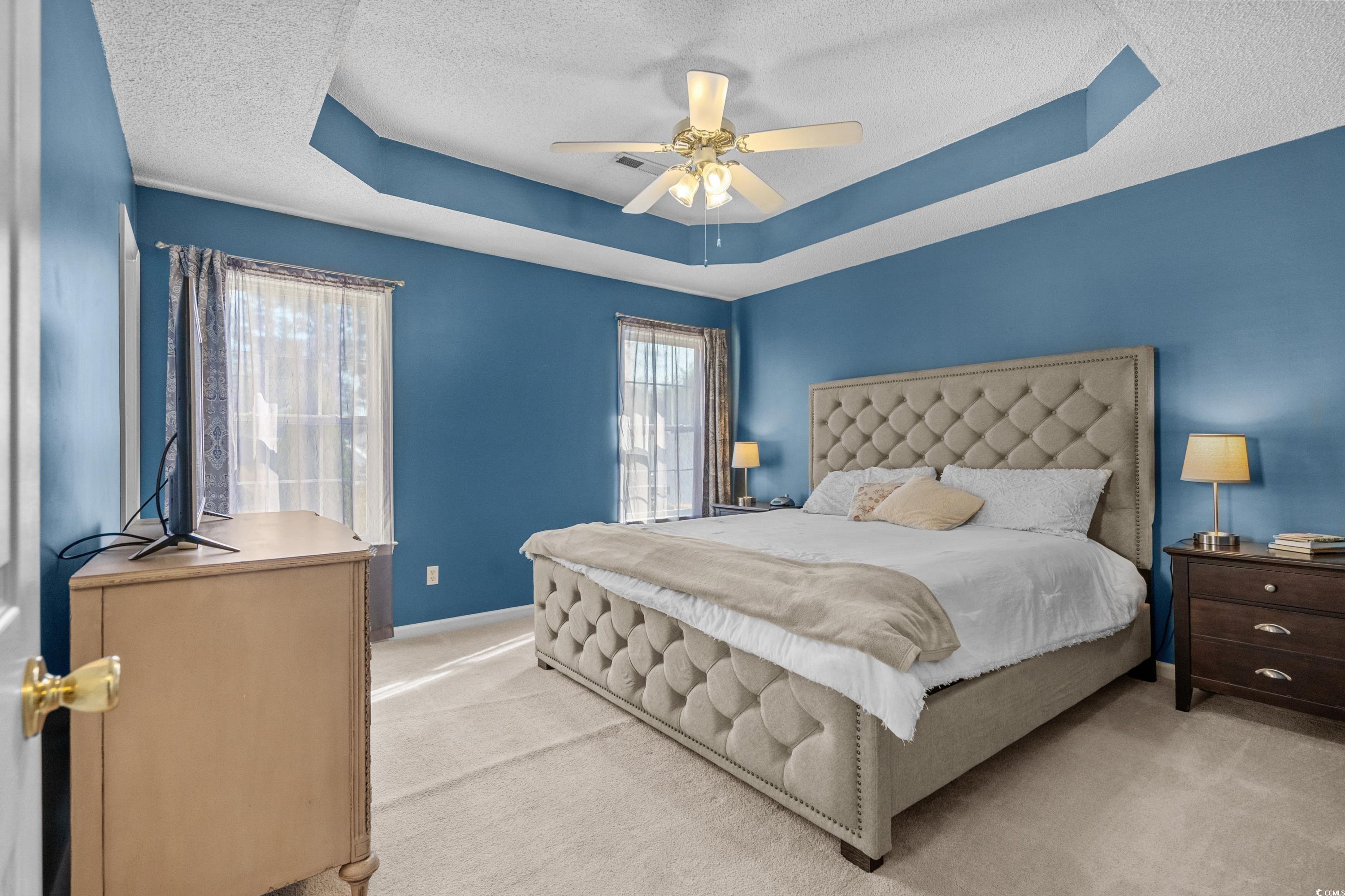300 Kildare Court Myrtle Beach, SC 29588 - Photo 12 of 26 Carpeted bedroom with ceiling fan, a textured ceil