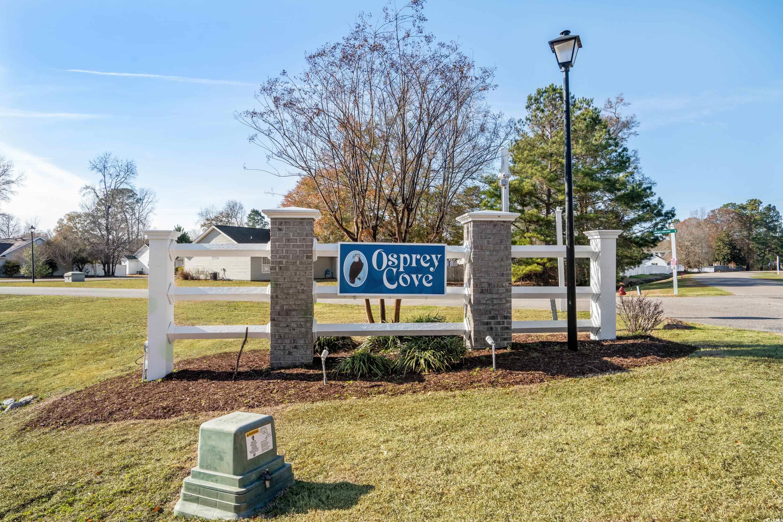 300 Kildare Court Myrtle Beach, SC 29588 - Photo 20 of 26 Community / neighborhood sign featuring a yard