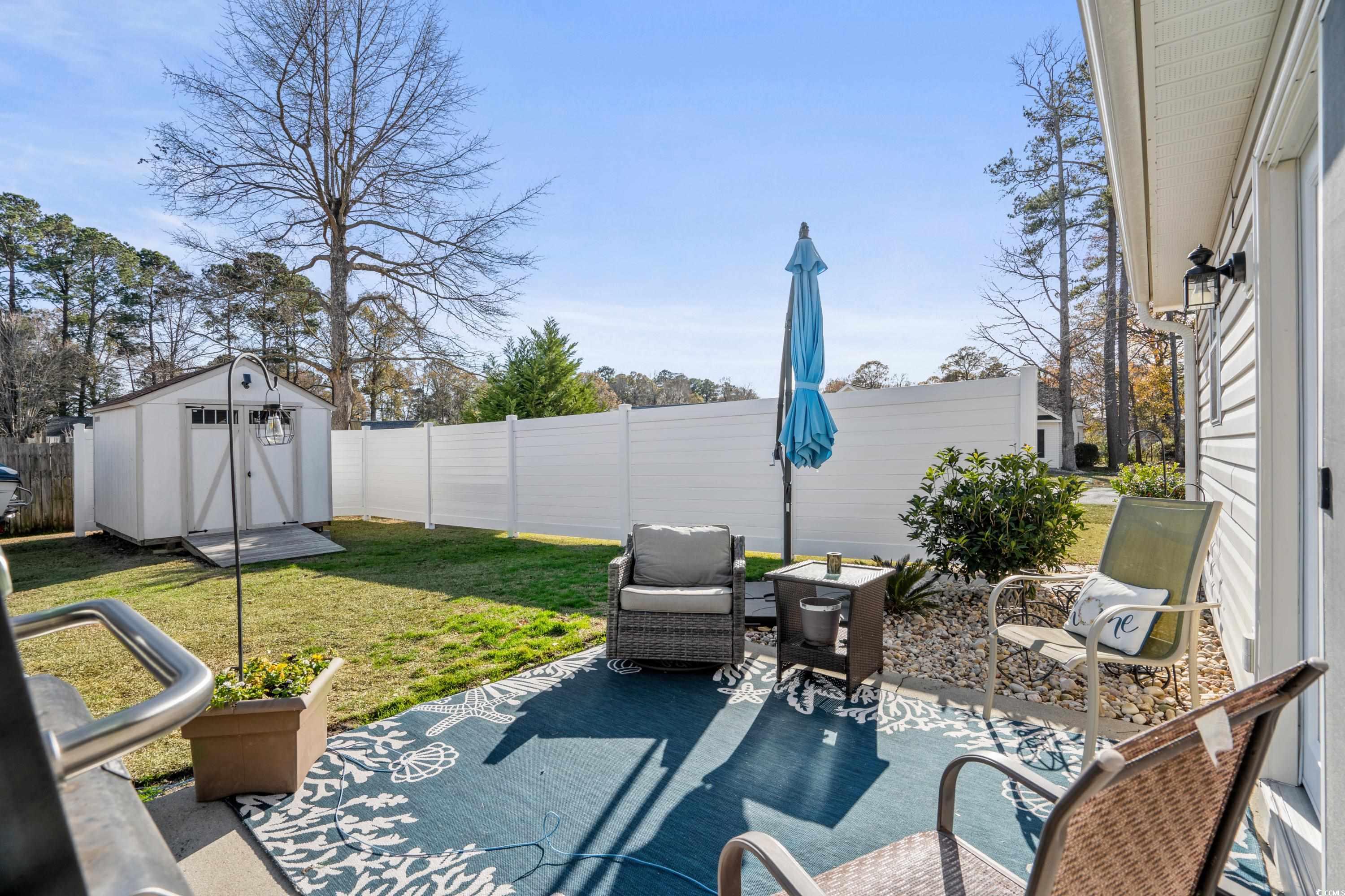300 Kildare Court Myrtle Beach, SC 29588 - Photo 21 of 26 View of patio with a shed