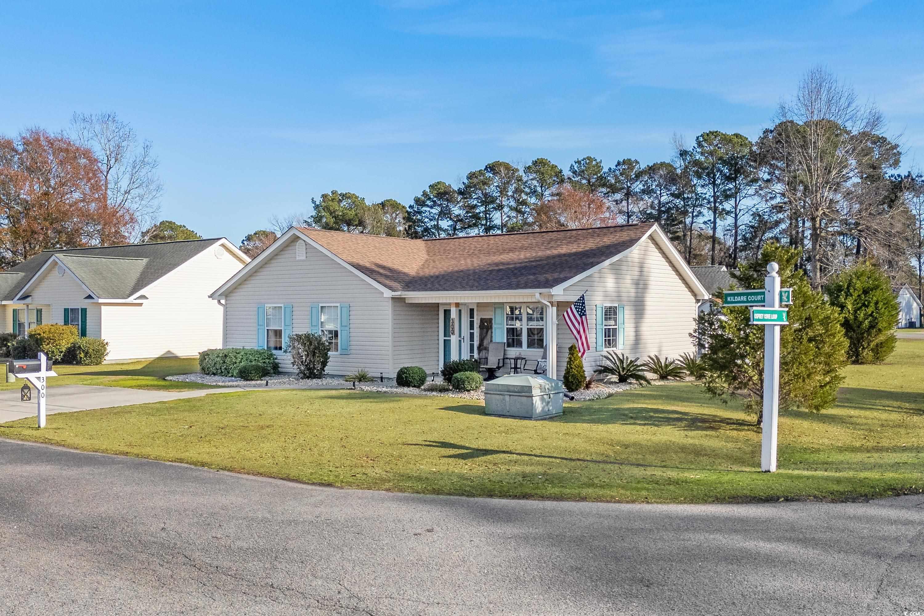 300 Kildare Court Myrtle Beach, SC 29588 - Photo 23 of 26 Ranch-style home with a porch and a front lawn