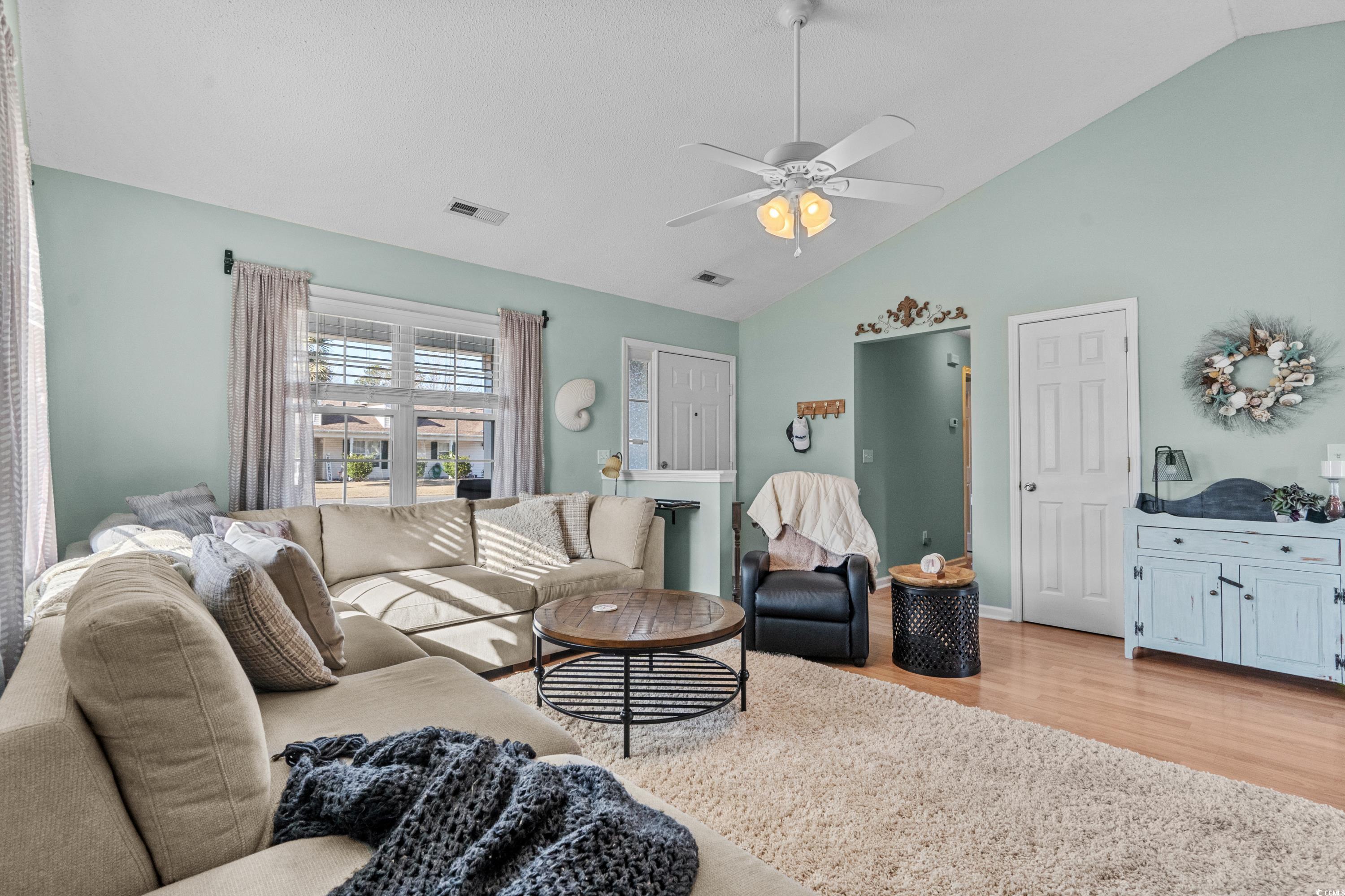 300 Kildare Court Myrtle Beach, SC 29588 - Photo 3 of 26 Living room with ceiling fan, high vaulted ceiling