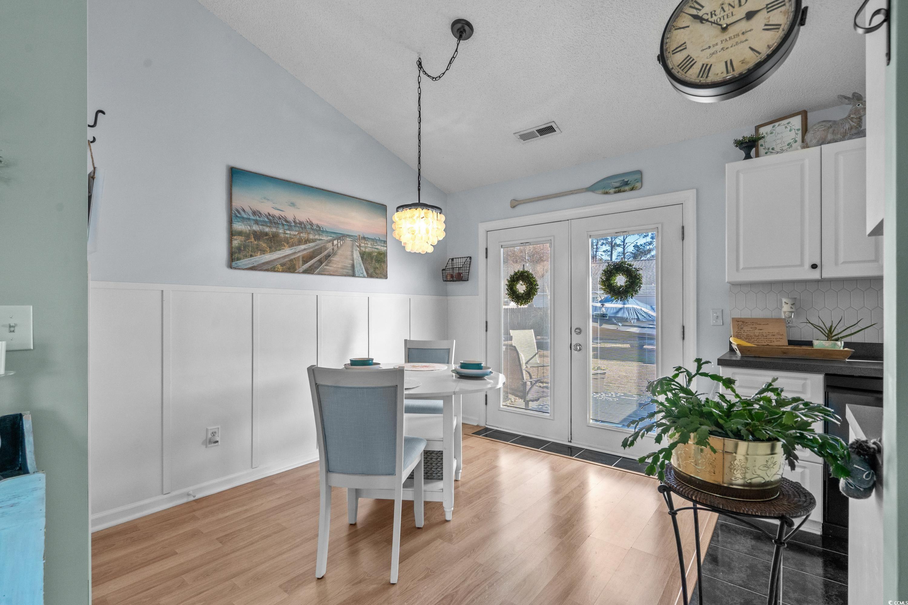 300 Kildare Court Myrtle Beach, SC 29588 - Photo 6 of 26 Dining room with french doors, lofted ceiling, and
