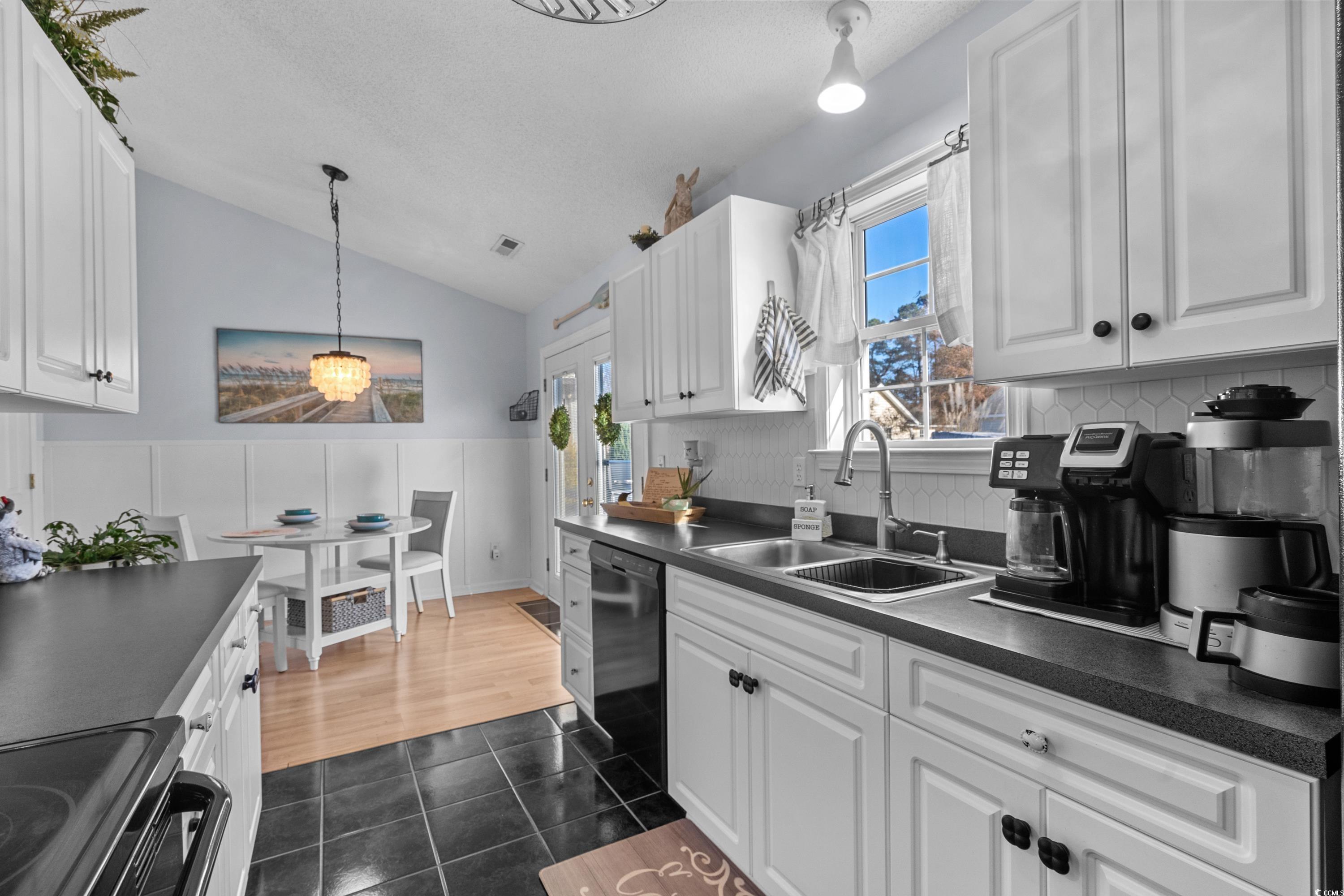 300 Kildare Court Myrtle Beach, SC 29588 - Photo 9 of 26 Kitchen with white cabinetry, dishwasher, sink, an