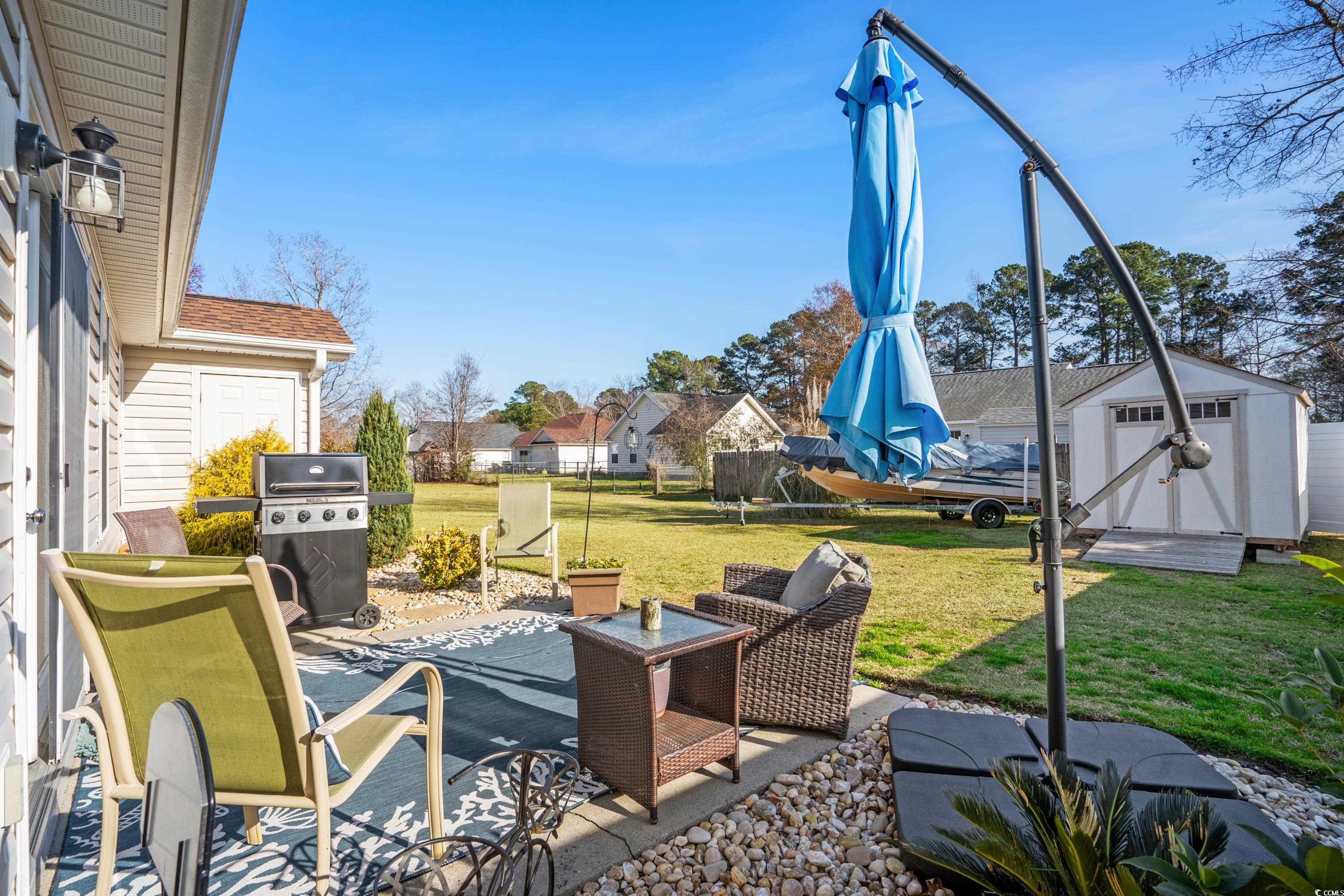 300 Kildare Court Myrtle Beach, SC 29588 - Photo 10 of 26 View of patio / terrace with a grill and a storage