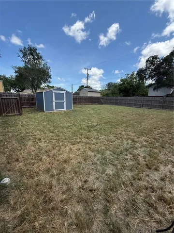 a backyard of a house with lots of green space