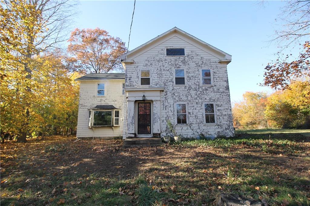 742 Ridge Road Orange, CT 06477 - Photo 1 of 1 a front view of a house with a yard