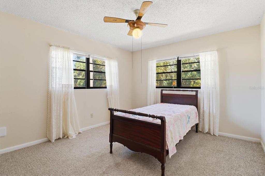 98 Sycamore Circle Homosassa, FL 34446 - Photo 19 of 34 a bedroom with a bed and a window