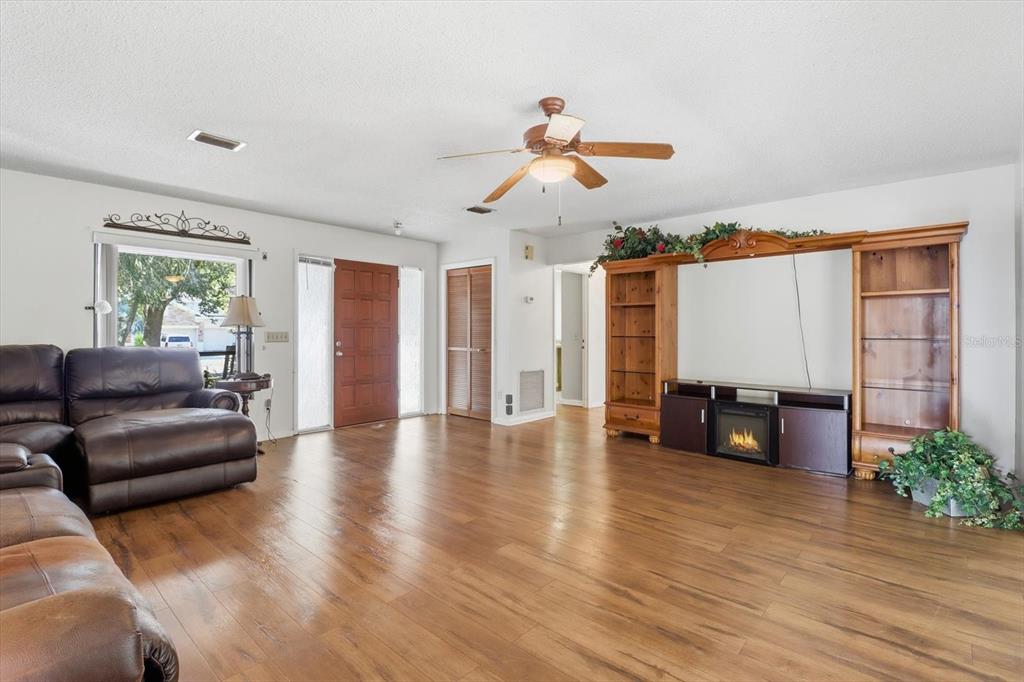 98 Sycamore Circle Homosassa, FL 34446 - Photo 6 of 34 a living room with furniture and wooden floor