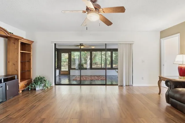 a view of room with window and wooden floor