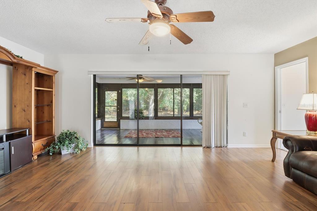 98 Sycamore Circle Homosassa, FL 34446 - Photo 8 of 34 a view of room with window and wooden floor