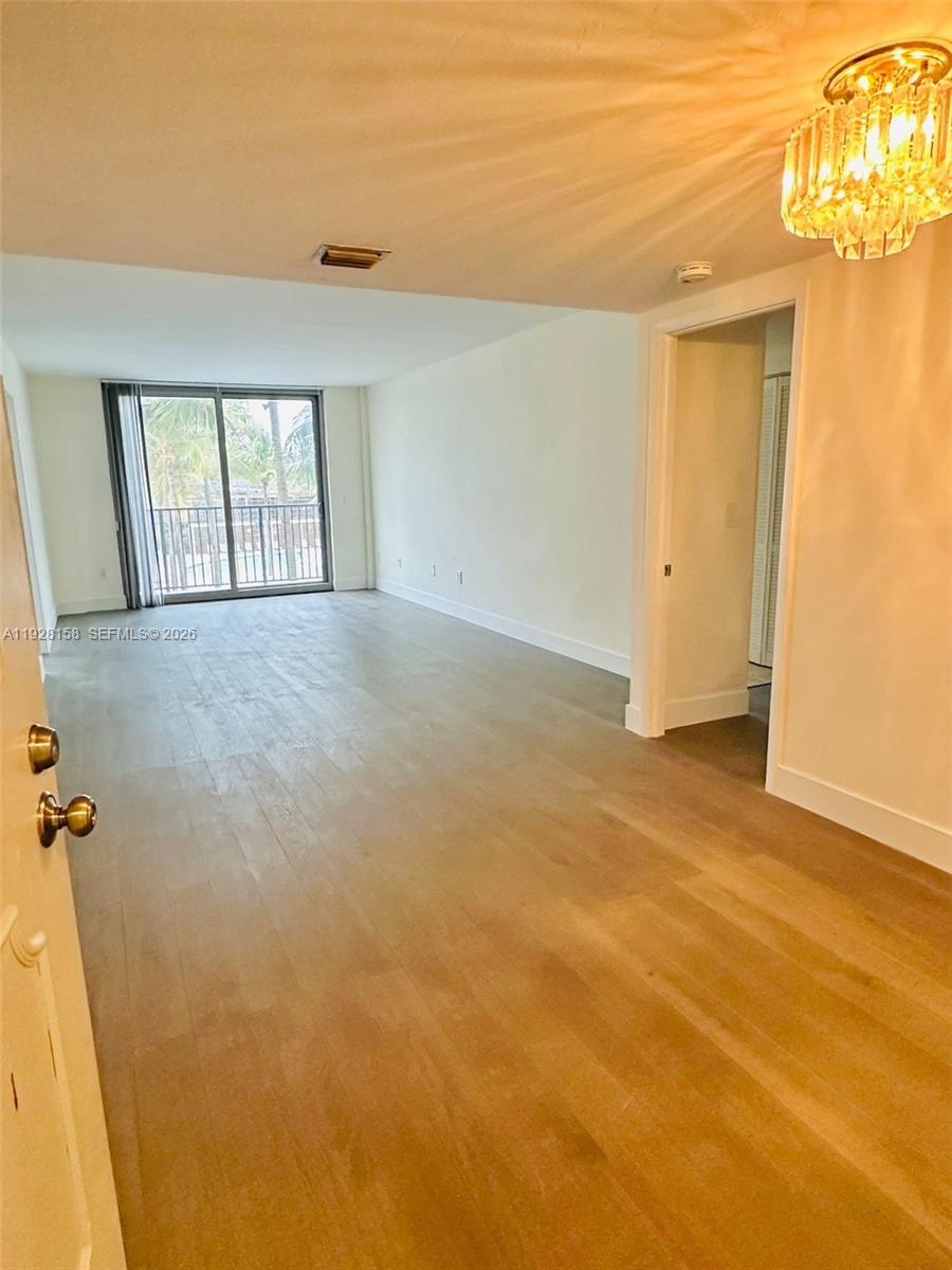 9273 Collins Avenue, Unit 207 Surfside, FL 33154 - Photo 2 of 14 a view of an empty room with a window