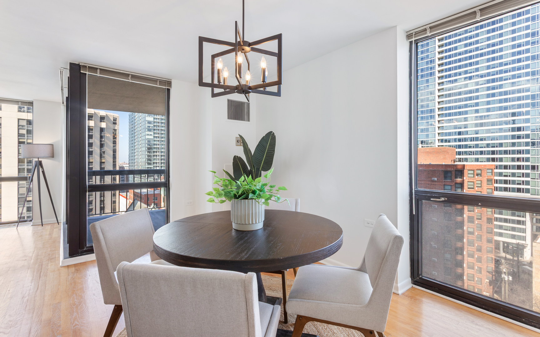1122 North Clark Street, Unit 1203 Chicago, IL 60610 - Photo 5 of 22 a view of a dining room with furniture window and wooden floor