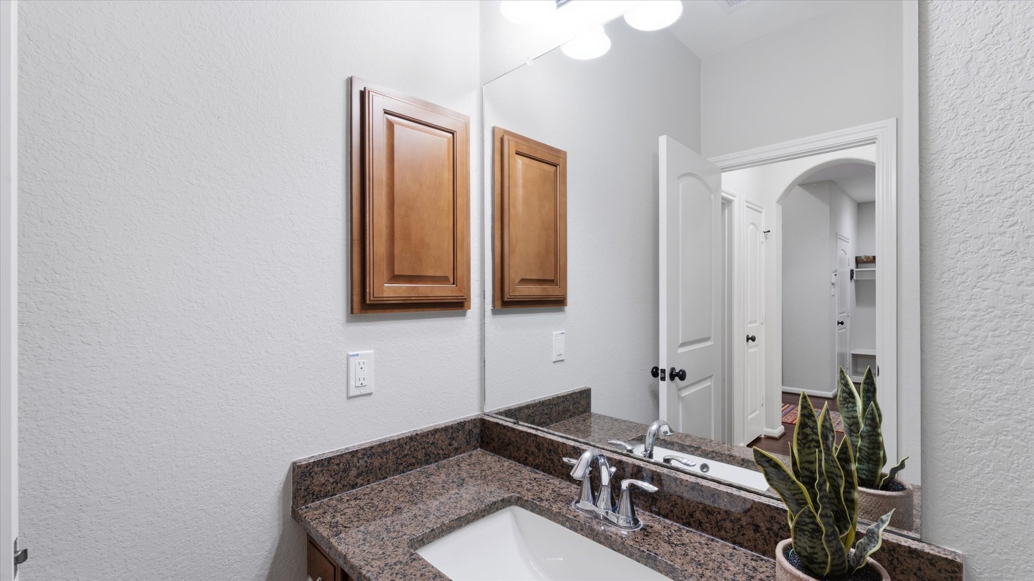 14 Painted Post Place Spring, TX 77389 - Photo 35 of 43 a bathroom with a sink and a mirror