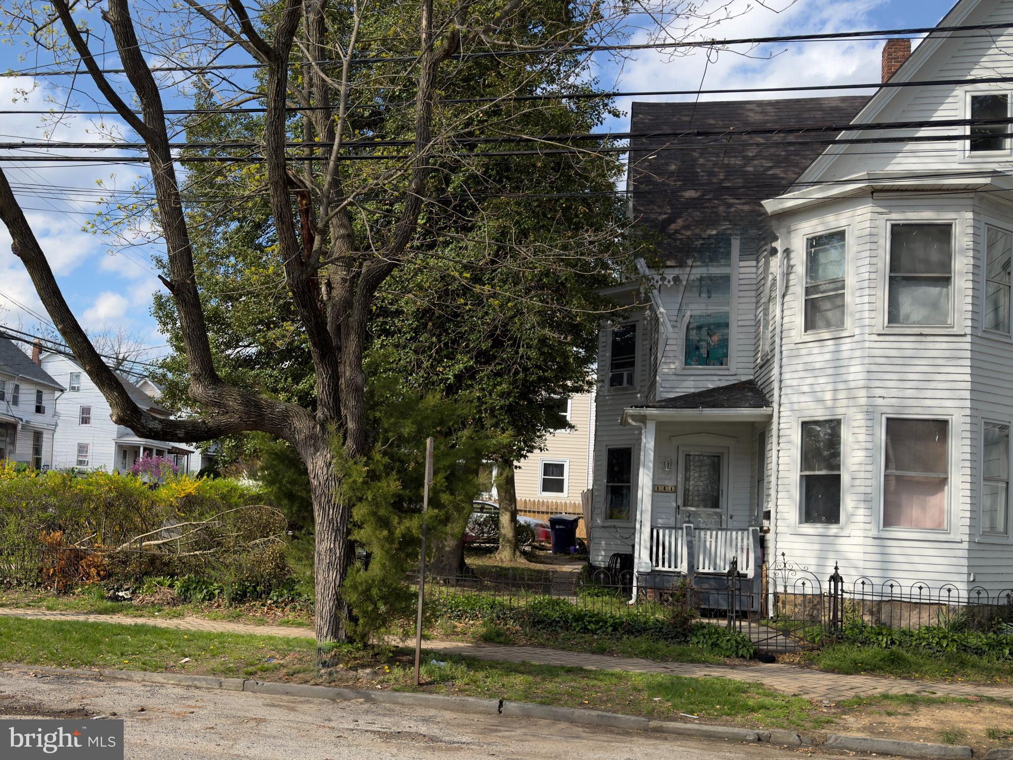 141 Hampton Street Bridgeton, NJ 08302 - Photo 1 of 18 a front view of a house with a yard