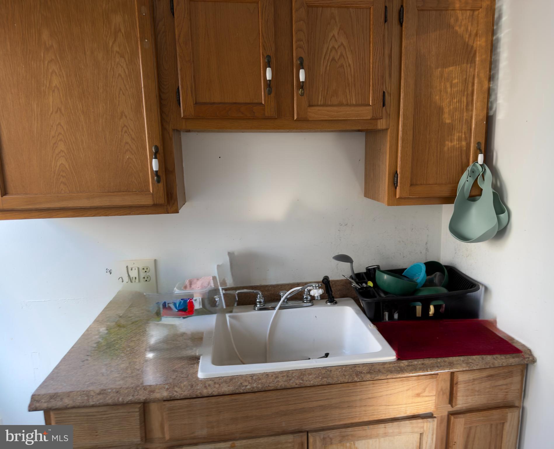 141 Hampton Street Bridgeton, NJ 08302 - Photo 11 of 18 a kitchen with sink and cabinets