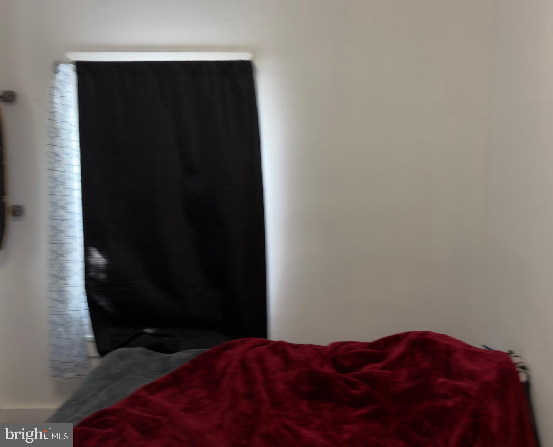 141 Hampton Street Bridgeton, NJ 08302 - Photo 13 of 18 a bedroom with a bed and a cabinet
