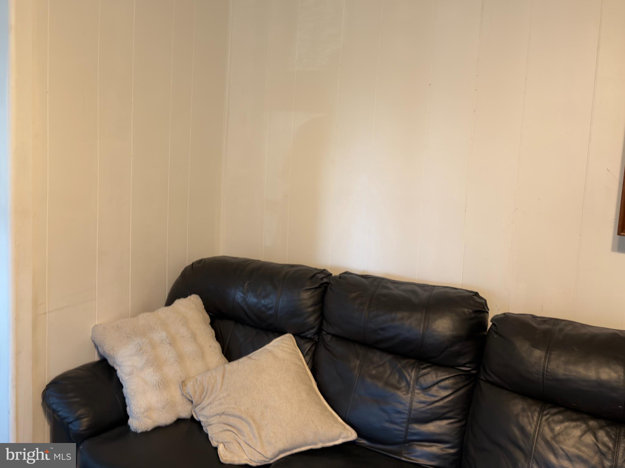 141 Hampton Street Bridgeton, NJ 08302 - Photo 5 of 18 a living room with furniture and a couch