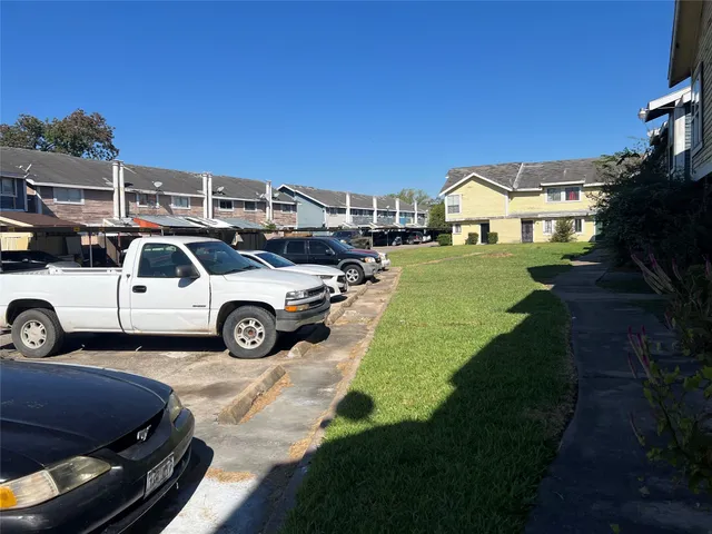 a view of a car parked in front of a house