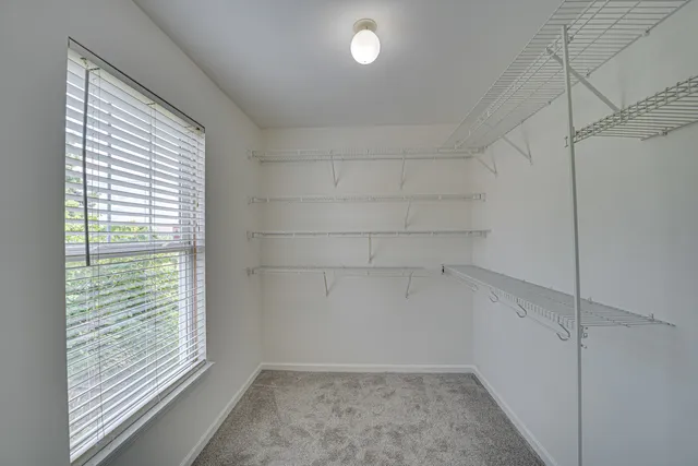 a view of a room that has a window in it