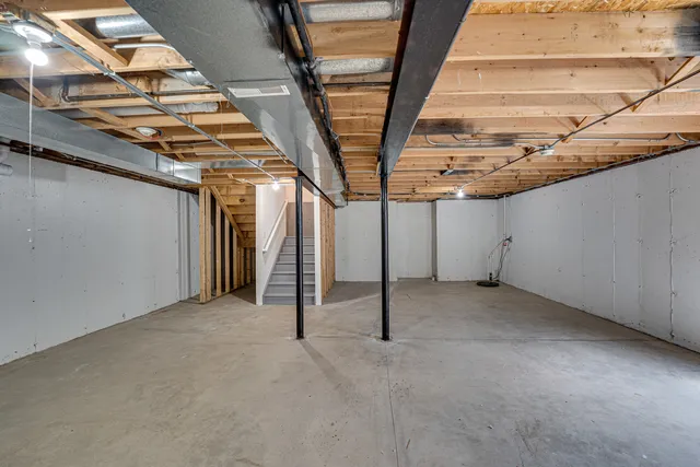 a view of a room with wooden walls