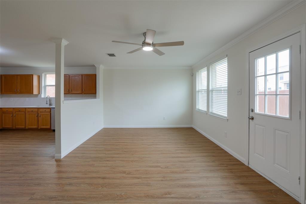 8422 Seven Hills Road Arlington, TX 76002 - Photo 15 of 28 wooden floor in an empty room with a window