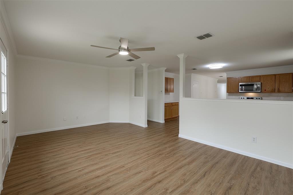 8422 Seven Hills Road Arlington, TX 76002 - Photo 16 of 28 a view of a kitchen with a sink and a refrigerator