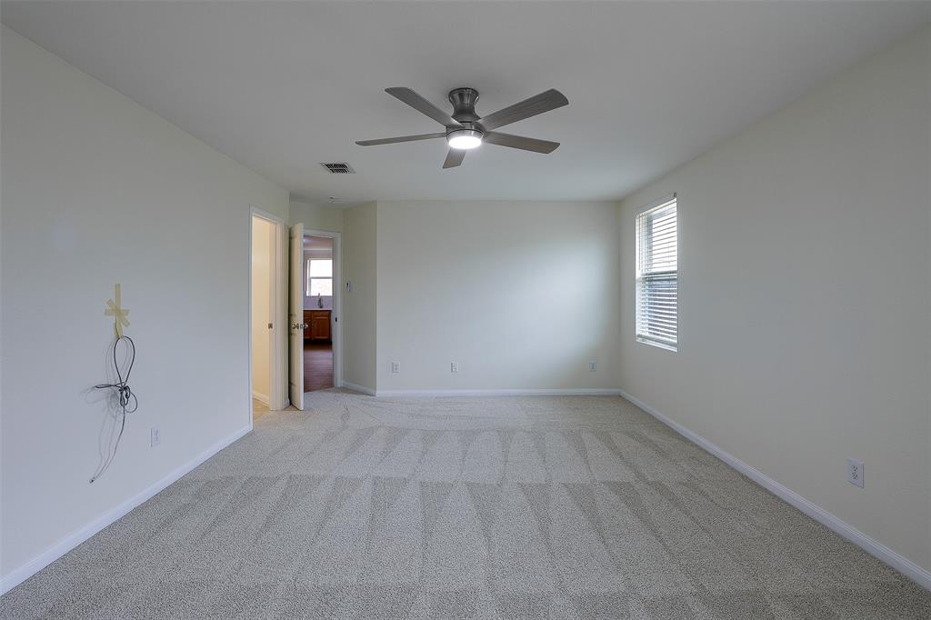 8422 Seven Hills Road Arlington, TX 76002 - Photo 18 of 28 wooden floor in an empty room with a window