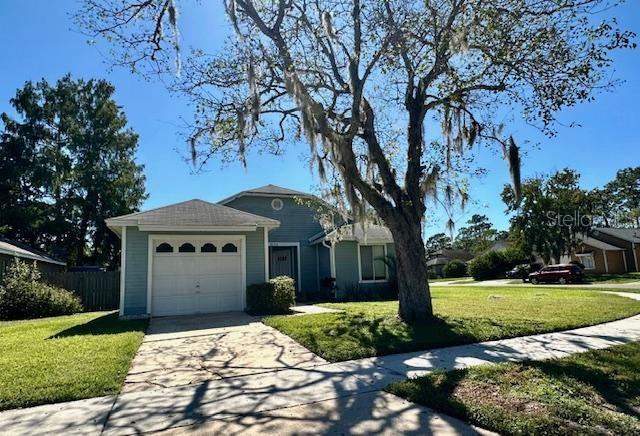 3153 Ginger Circle Orlando, FL 32826 - Photo 1 of 16 a front view of a house with a yard