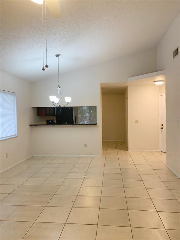 3153 Ginger Circle Orlando, FL 32826 - Photo 6 of 16 an empty room with cabinet and mirrors