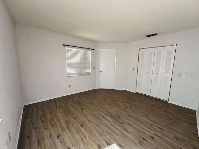 3153 Ginger Circle Orlando, FL 32826 - Photo 7 of 16 a view of empty room with wooden floor and fan