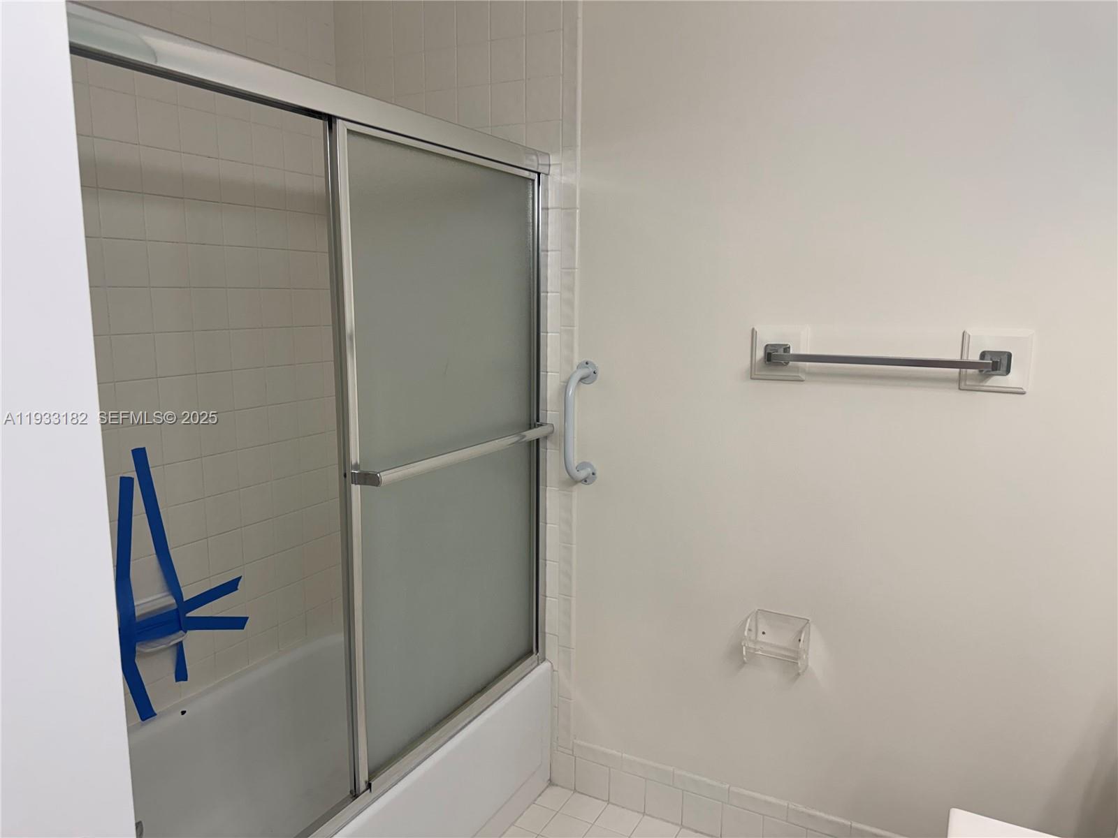 8200 Whispering Palm Drive, Unit F Boca Raton, FL 33496 - Photo 11 of 19 a bathroom with a shower