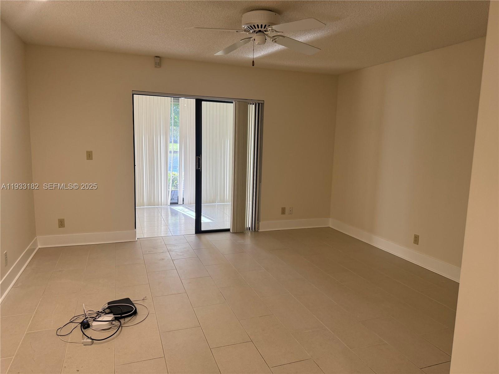 8200 Whispering Palm Drive, Unit F Boca Raton, FL 33496 - Photo 16 of 19 a view of an empty room with a window