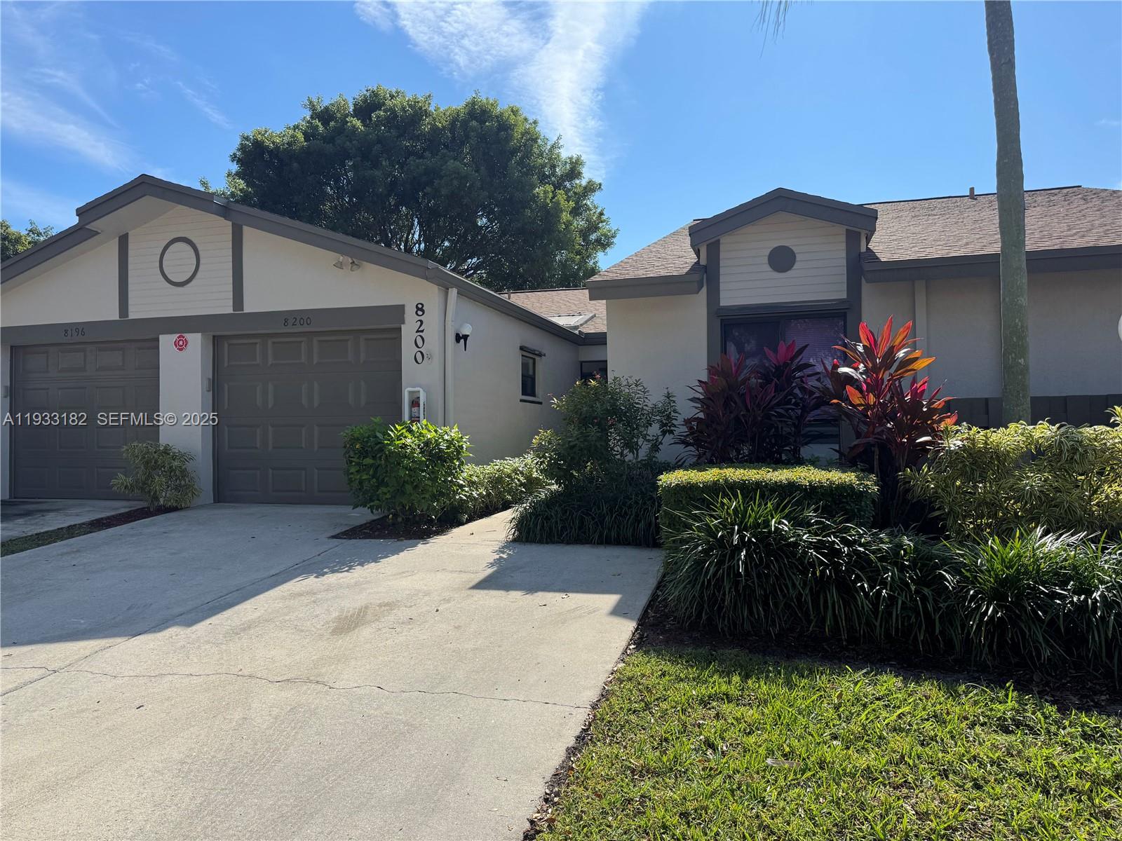 8200 Whispering Palm Drive, Unit F Boca Raton, FL 33496 - Photo 18 of 19 a house view with a garden space