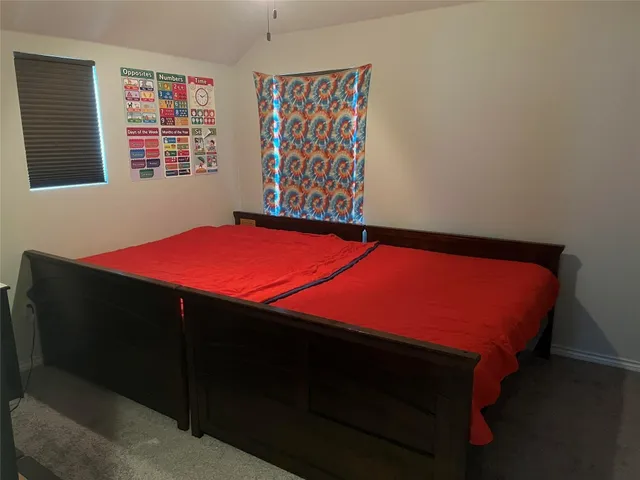 a room with a bed and a window