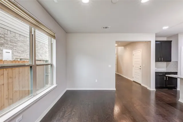 a kitchen with stainless steel appliances granite countertop stove top oven and refrigerator