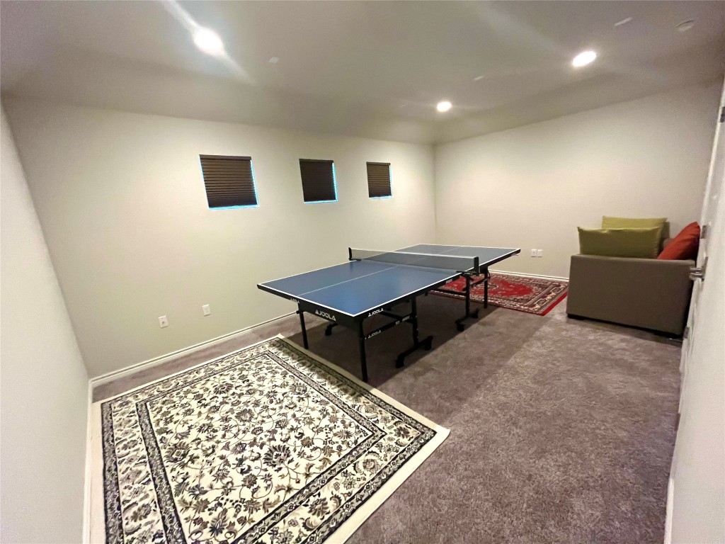 14104 McCoy Loop, Unit 3 Austin, TX 78717 - Photo 16 of 19 a living room with a couch and a coffee table