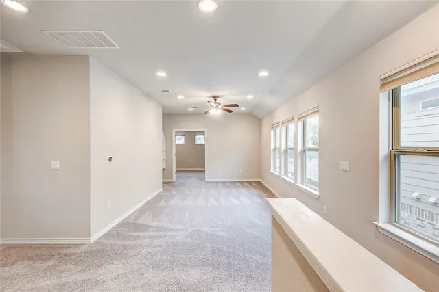 a bathroom with a double vanity sink a large mirror and shower