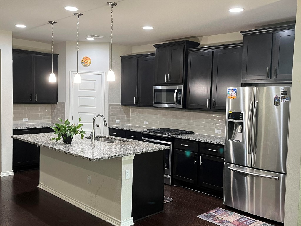 14104 McCoy Loop, Unit 3 Austin, TX 78717 - Photo 3 of 19 a kitchen with a refrigerator sink and microwave