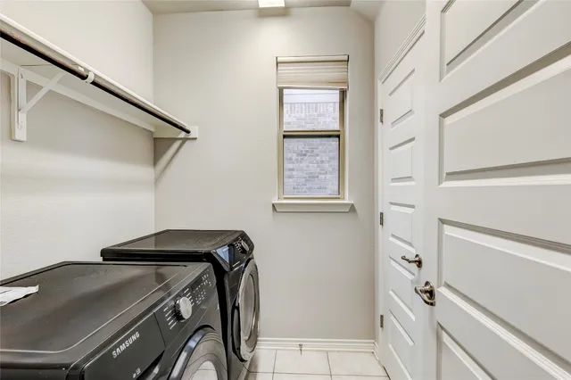 a bathroom with a sink a toilet a mirror and shower