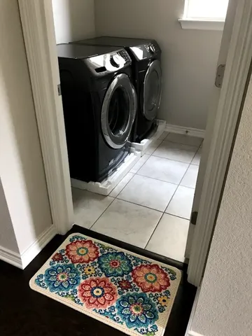 a view of a washer and dryer in a bathroom