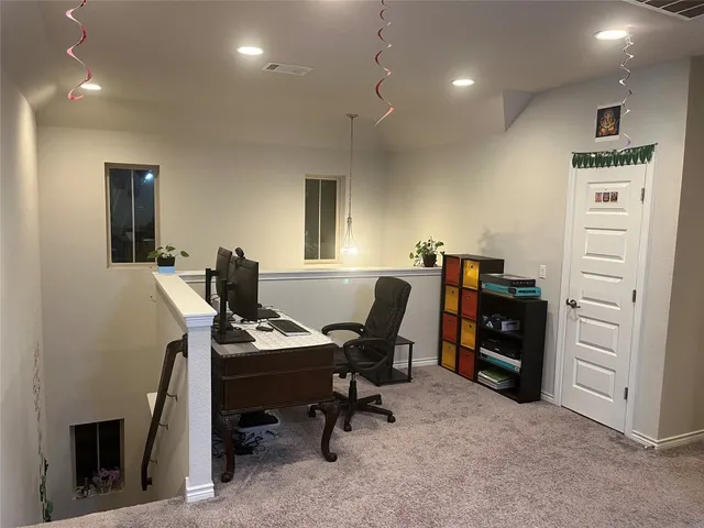 a view of a workspace with furniture