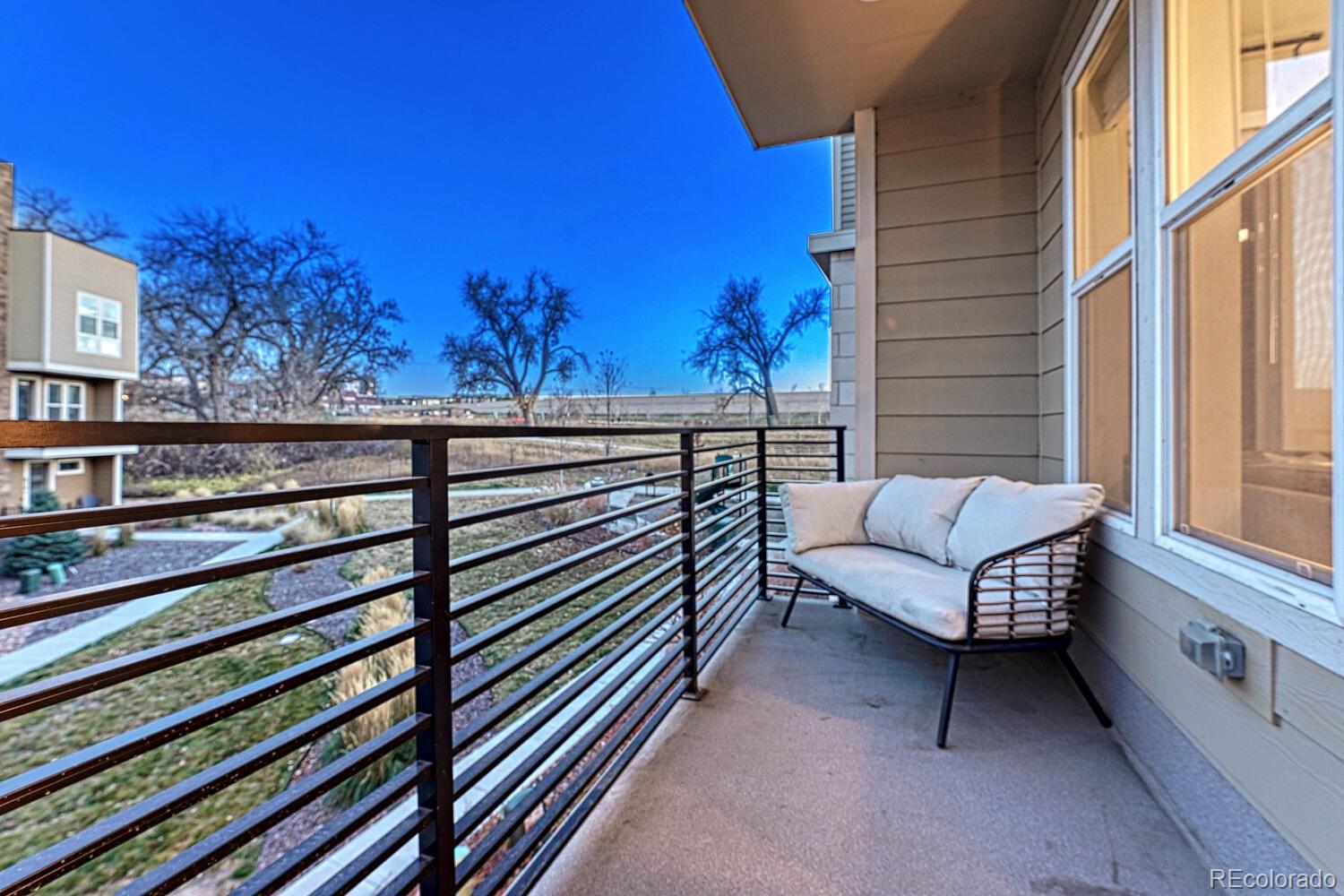 8338 Rivulet Point Highlands Ranch, CO 80129 - Photo 20 of 46 a view of a bench in a balcony